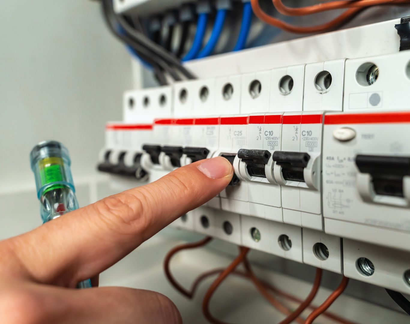 Experienced Electrician in Charleston County, SC performing electrical panel repairs in a residential property