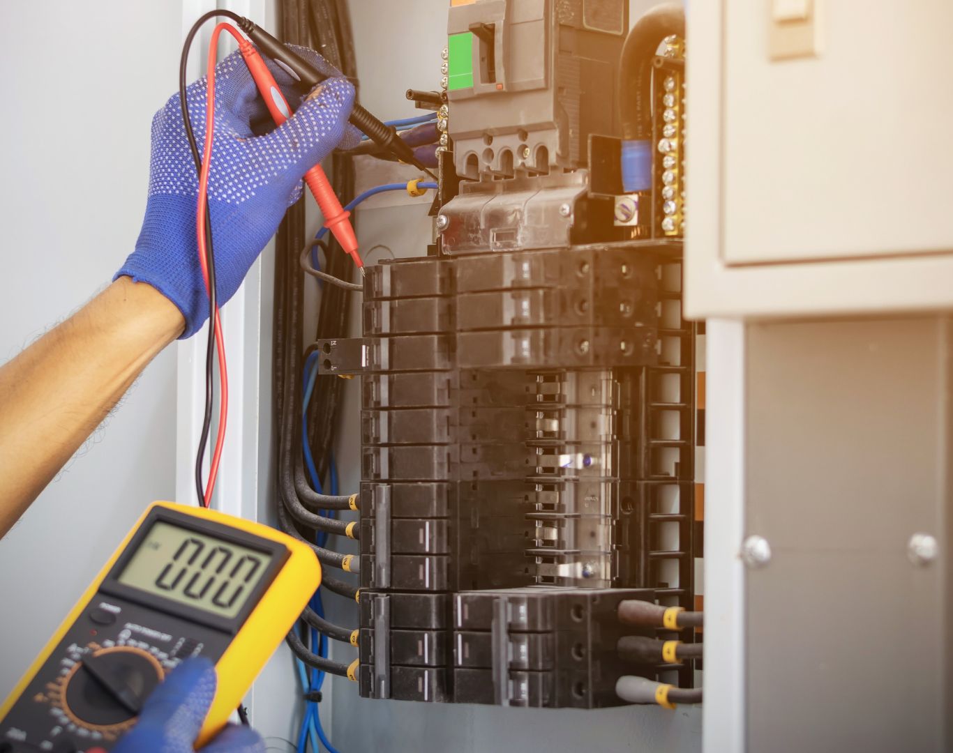 Professional Electrician in Goose Creek, SC performing electrical wiring upgrades in a residential property