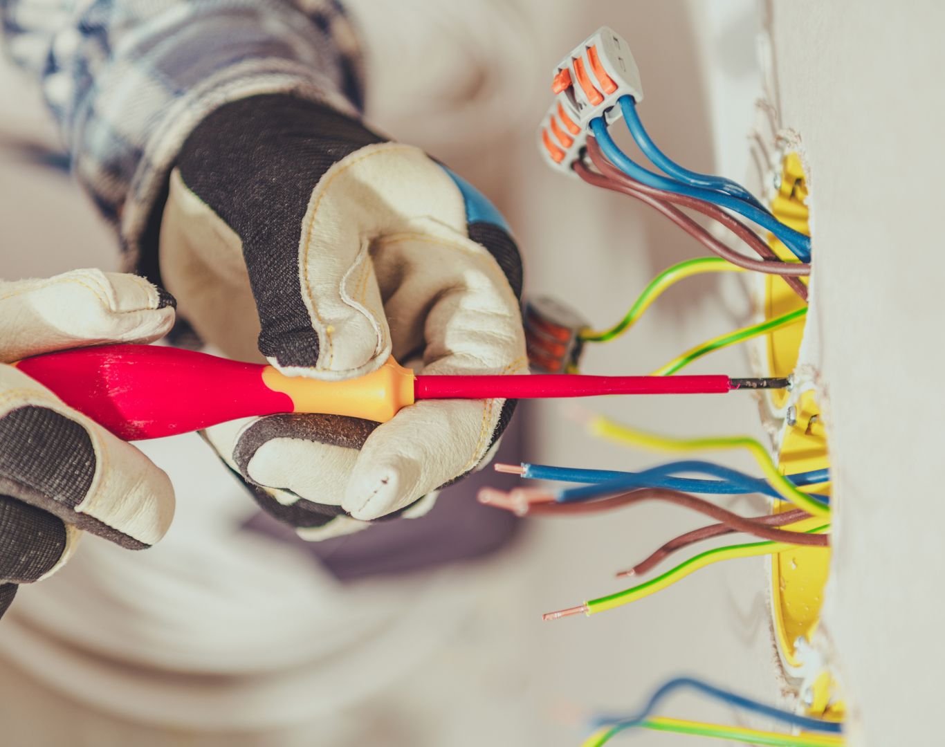 Skilled Electrician in Downtown Charleston, SC completing electrical upgrades in a residential property